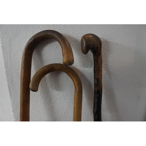 338 - A vintage blackthorn walking stick and two other walking canes.