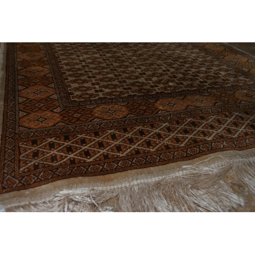 341 - A vintage orange and brown patterned mat.