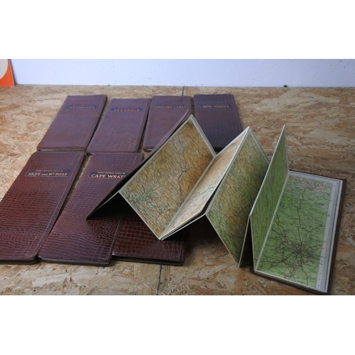 358 - A collection of eight leather bound Great Britain maps.