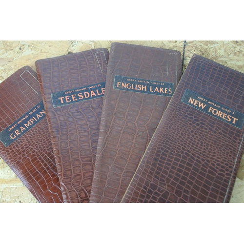 358 - A collection of eight leather bound Great Britain maps.