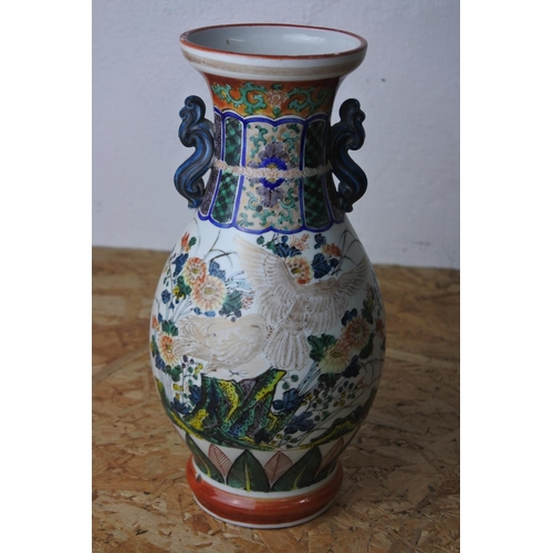 372 - An antique Japanese vase with decorative design & seal to base.