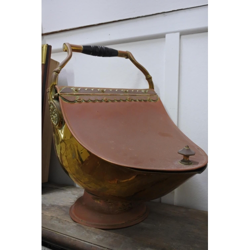 397 - An antique brass coal scuttle.