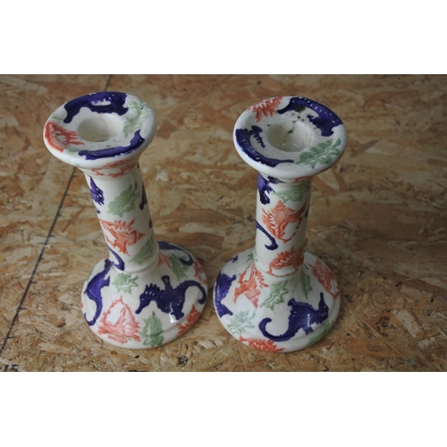 410 - A pair of decorative Emma Bridgewater candlesticks.