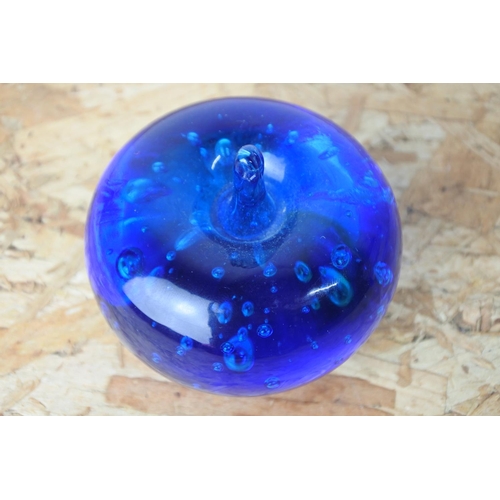 414 - A stunning blue glass 'apple' paperweight.