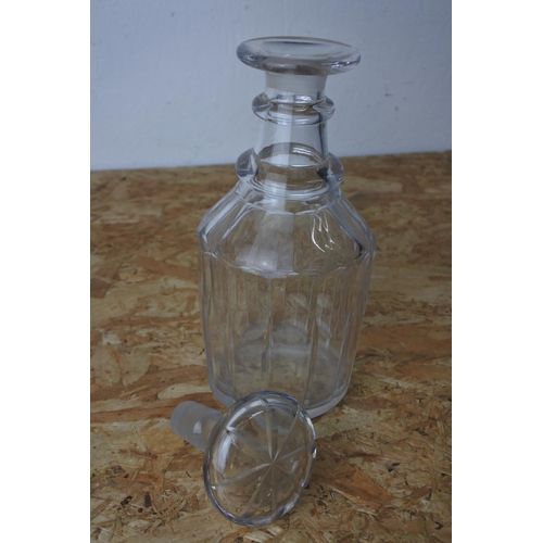 419 - A glass decanter and stopper.