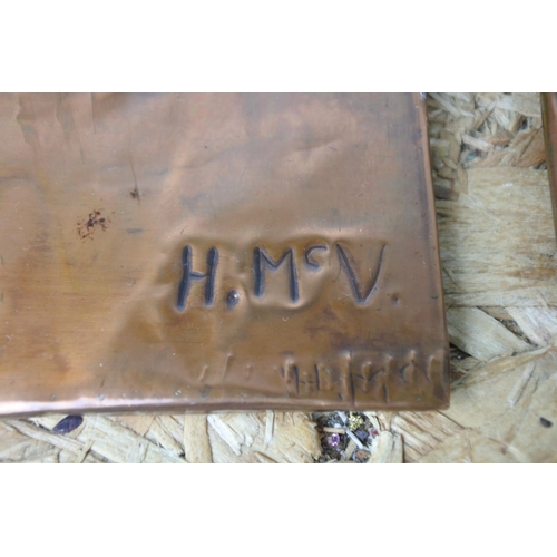 421 - A pair of vintage embossed plaques signed HMcV.