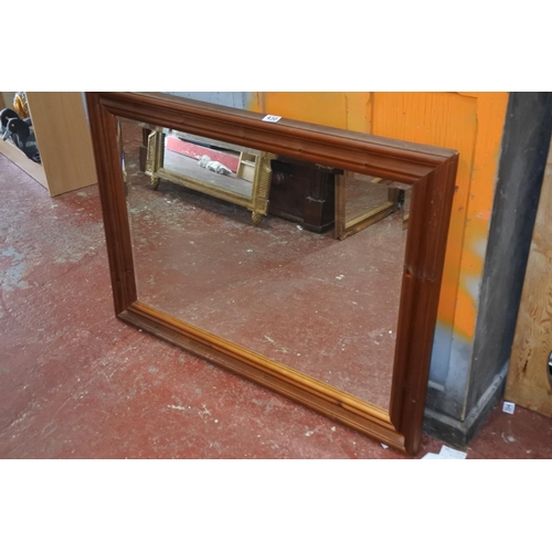 430 - A large pine framed mirror.