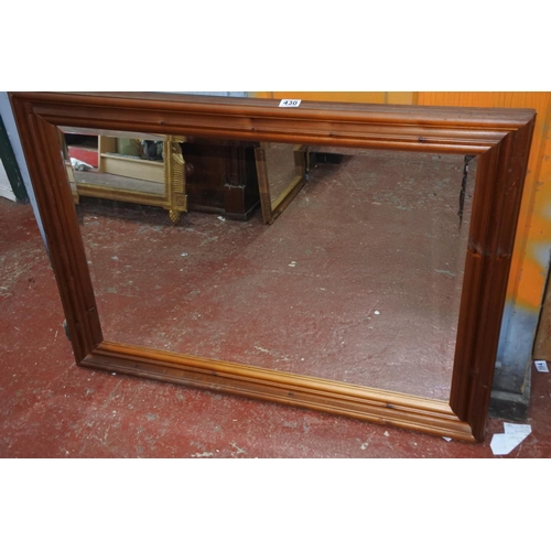 430 - A large pine framed mirror.