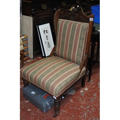 434 - An antique upholstered nursing chair.