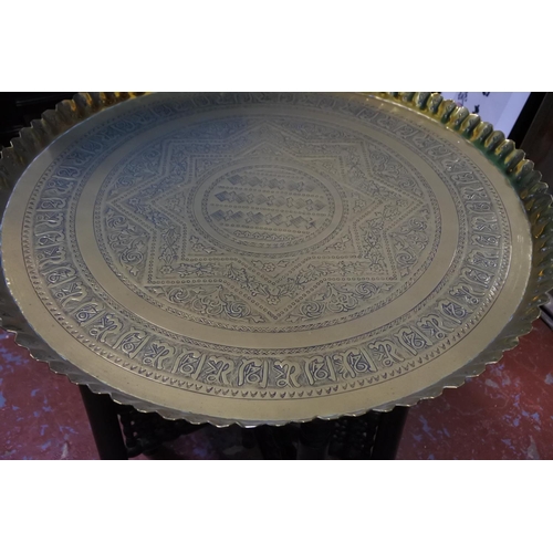 436 - A stunning large antique brass tray on folding base.