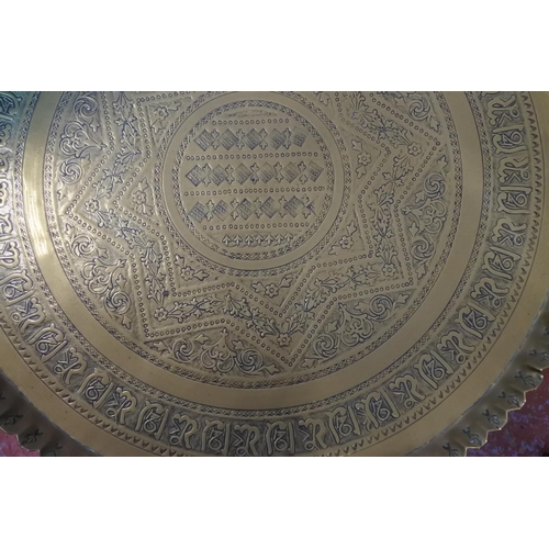 436 - A stunning large antique brass tray on folding base.