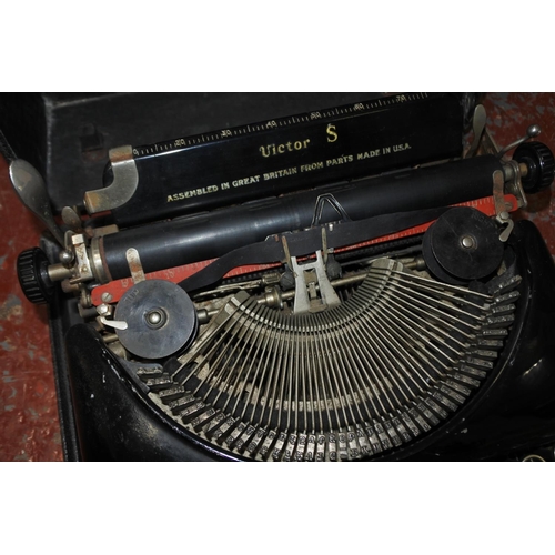 438 - A vintage cased Victor S typewriter.