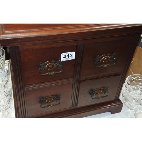 443 - A four drawer small mahogany chest.