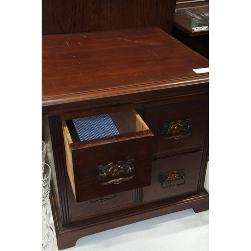 443 - A four drawer small mahogany chest.