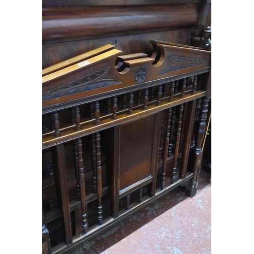 449 - A pair of antique mahogany single bed headboards.