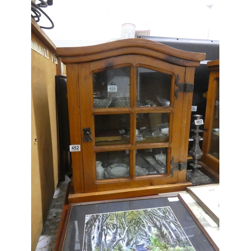 452 - A small wall mounted display cabinet.