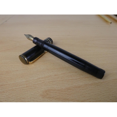 475 - A vintage Swan Leverless pen, a vintage Parker Victory pen and more.