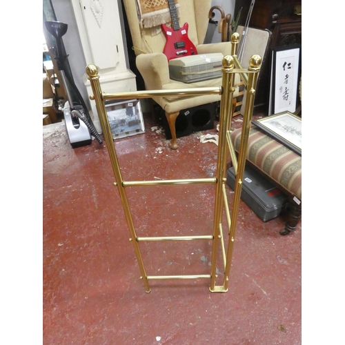 485 - A brass folding towel rail.