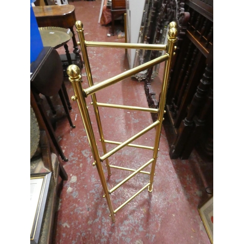 485 - A brass folding towel rail.