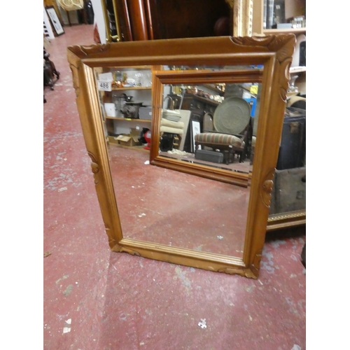 486 - A pine framed wall mirror.