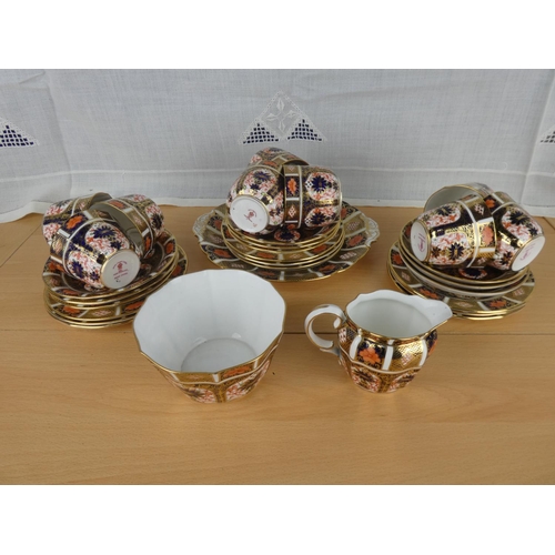 490 - A stunning collection of Royal Crown Derby china to include cups, saucers, plates, cake plate, milk ... 