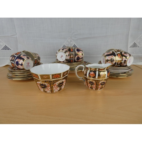 490 - A stunning collection of Royal Crown Derby china to include cups, saucers, plates, cake plate, milk ... 