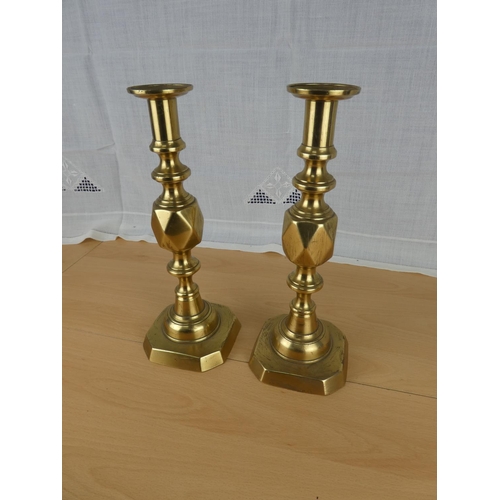 498 - A stunning pair of 'The King of Diamonds' brass candlesticks.