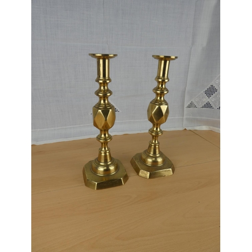 498 - A stunning pair of 'The King of Diamonds' brass candlesticks.