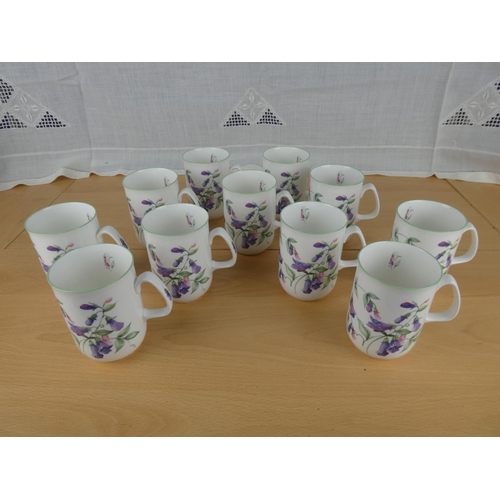 501 - A set of 11 Rose of England bone china mugs.