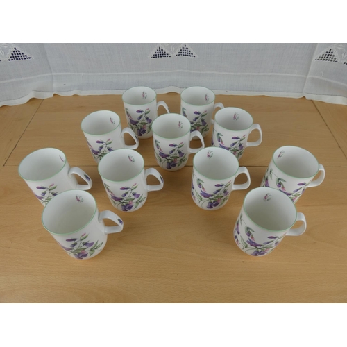 501 - A set of 11 Rose of England bone china mugs.