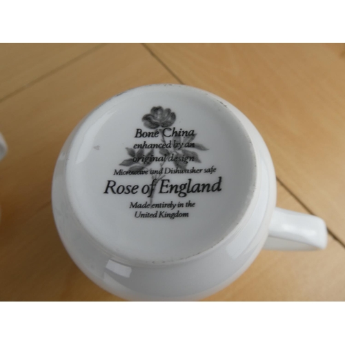 501 - A set of 11 Rose of England bone china mugs.