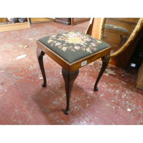 502 - A tapestry topped piano stool.