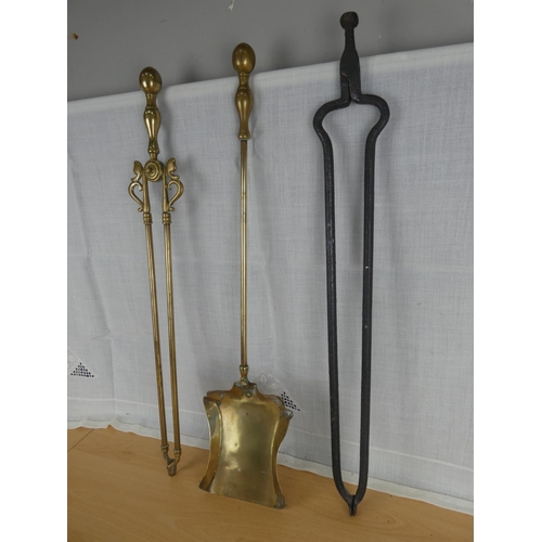 509 - A pair of Victorian brass fire irons and a pair of cottage iron tongs.