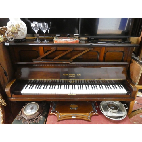 513 - A mahogany cased upright piano.