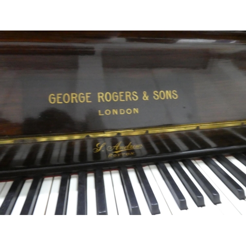 513 - A mahogany cased upright piano.