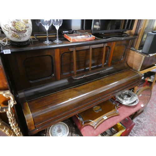 513 - A mahogany cased upright piano.