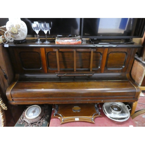 513 - A mahogany cased upright piano.