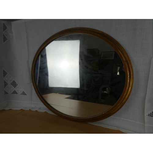 519 - A circular framed wall mirror.