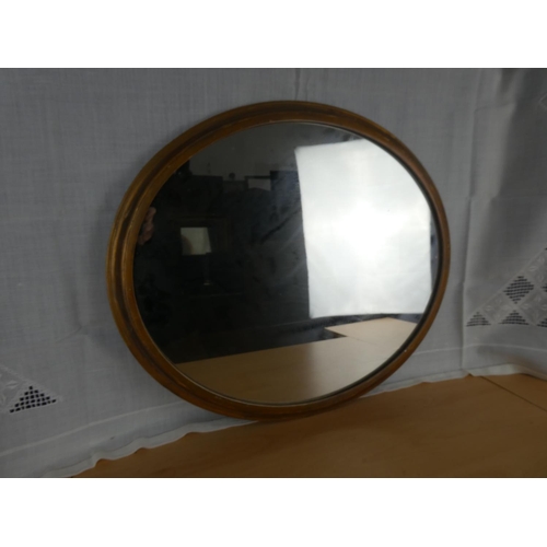 519 - A circular framed wall mirror.