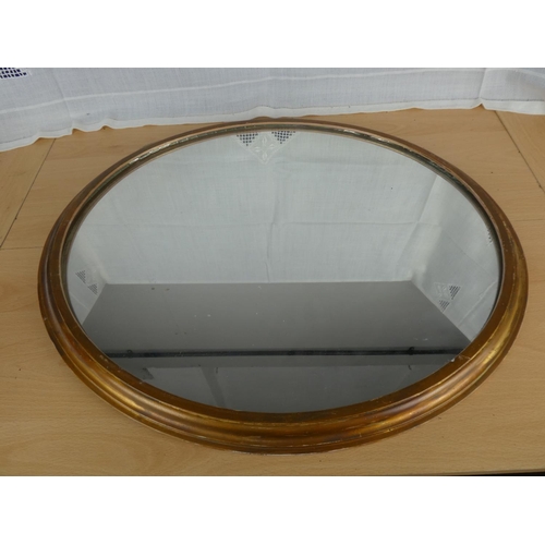 519 - A circular framed wall mirror.