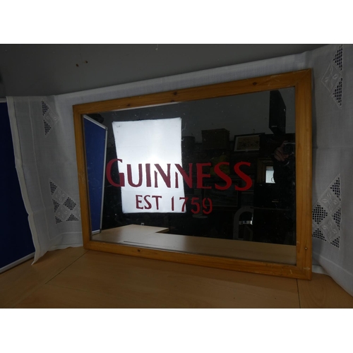 520 - A Guinness wall mirror.