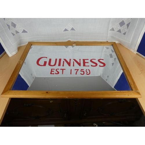 520 - A Guinness wall mirror.