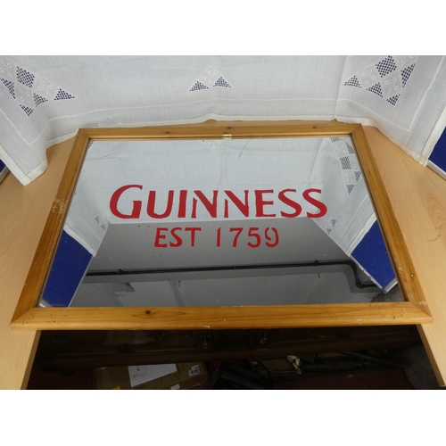 520 - A Guinness wall mirror.