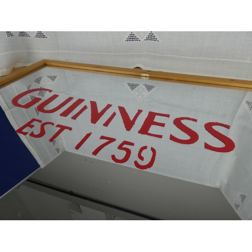 520 - A Guinness wall mirror.