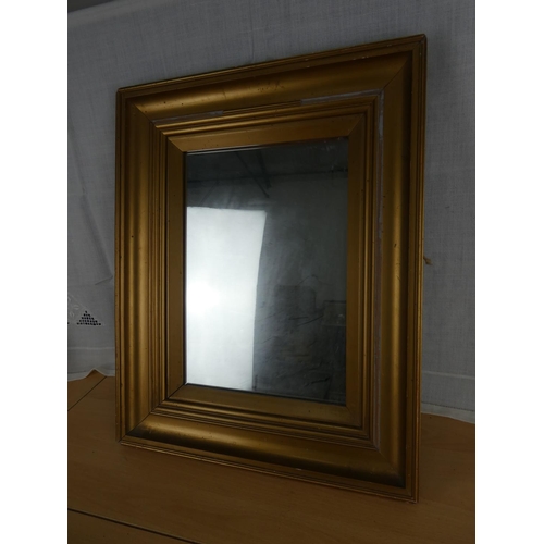 522 - A gilt framed wall mirror.