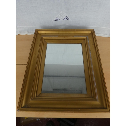 522 - A gilt framed wall mirror.