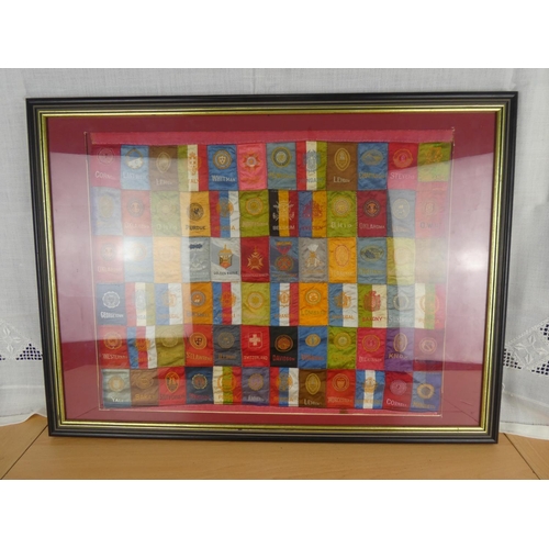 526 - An unusual framed collage of silk Mason's flags.