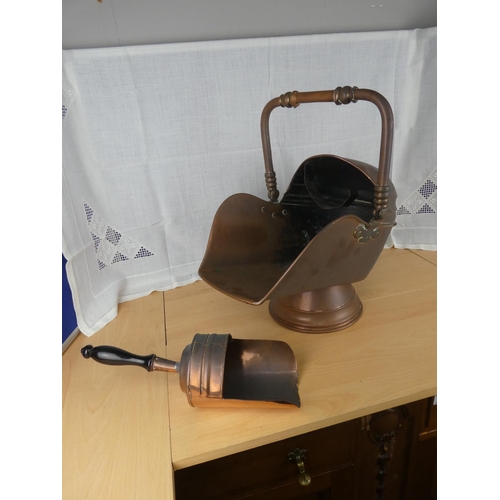 538 - An antique copper coal scuttle and shovel.