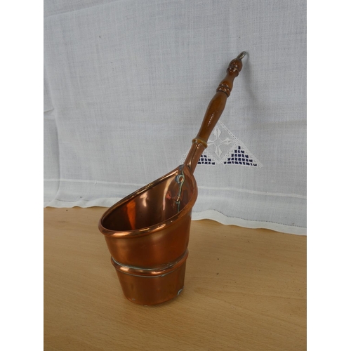 540 - An antique copper handled pot.