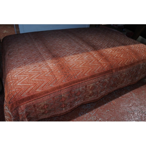 550 - A large upholstered footstool, measuring 33